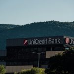Unicredit bank building with trees and hills bank building exterior, atm machine, financial office interior