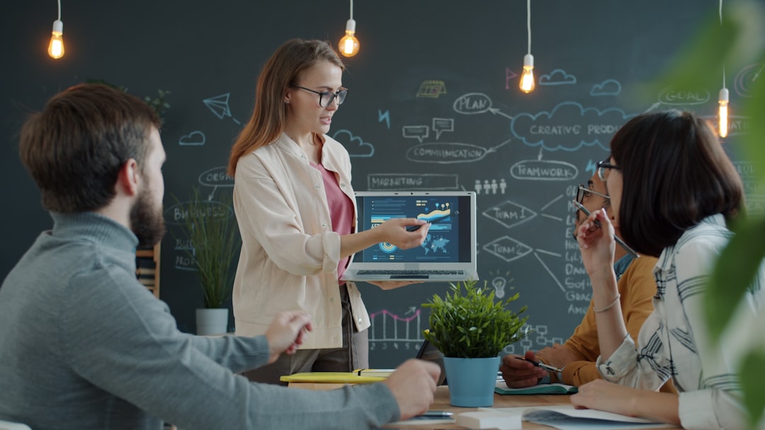Woman presenting a business strategy to colleagues business automation dashboard, enterprise workflow, team collaboration screen, data integration chart