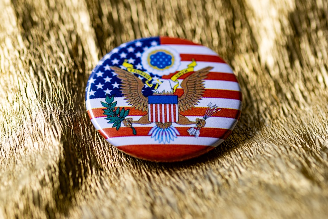 A button with an american flag and eagle on it us electoral map red blue states campaign pins