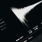 A computer screen with a sound wave on it command line, audio conversion, waveform
