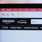 a computer screen with the amazon logo on it person laptop amazon boxes checklist