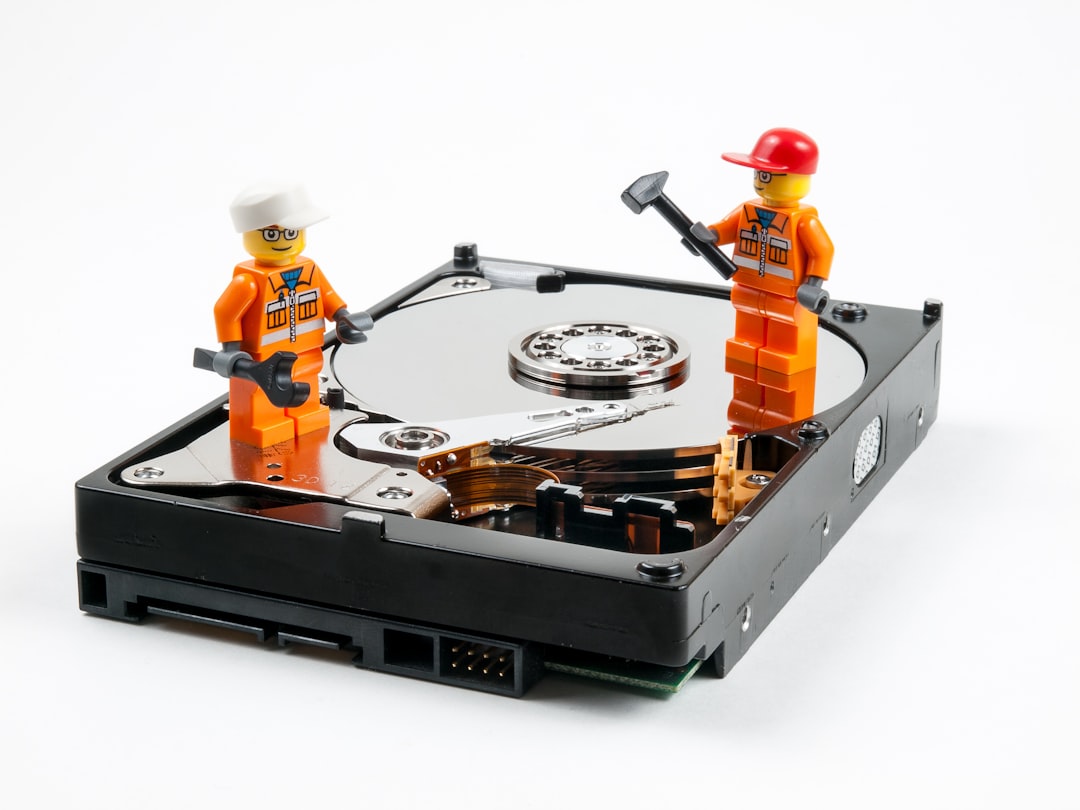 a couple of legos standing next to a hard drive mac disk utility, erase drive, exfat format
