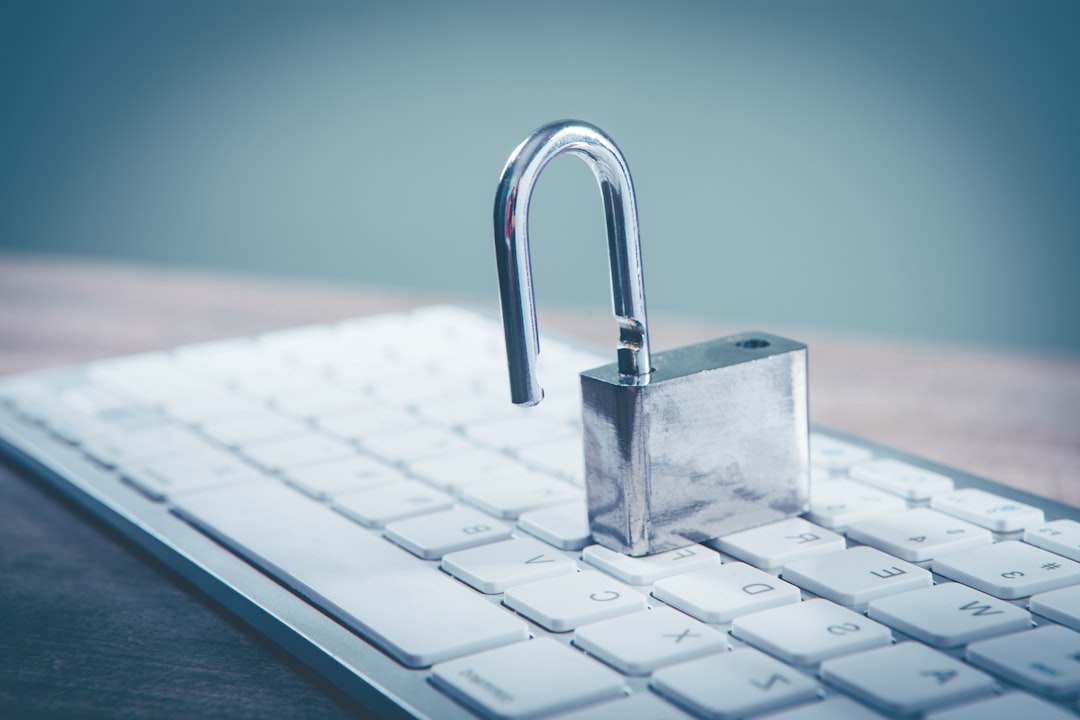 a padlock sitting on top of a computer keyboard encrypted file sharing, secure link sharing screen, cloud security concept