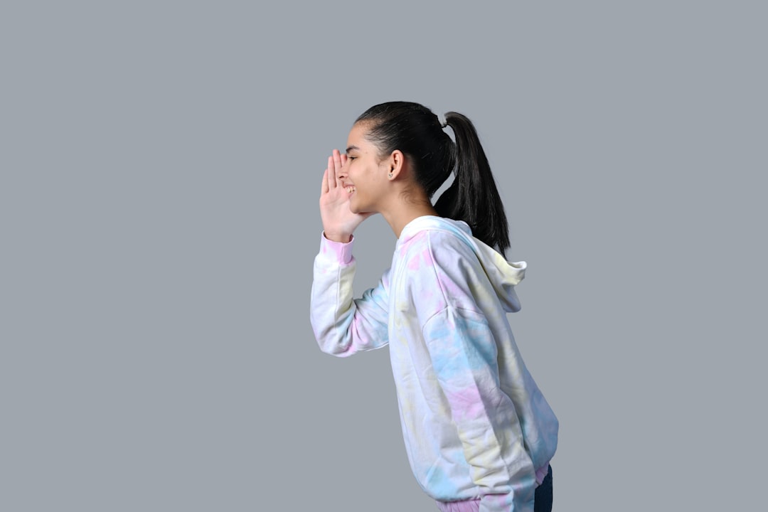a person with the hand on the face breathing exercise, lip trill, warmup routine