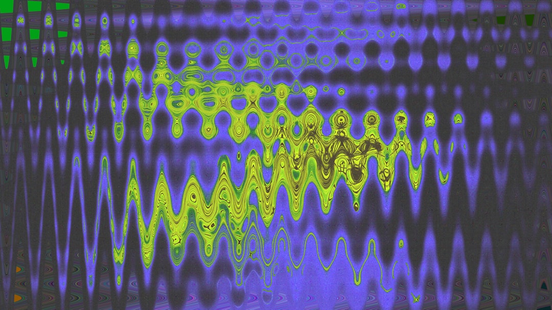A picture of a computer screen with a pattern on it audio waveform editing software screen colorful sound waves