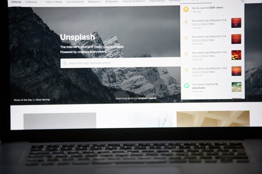 an open laptop computer sitting on top of a desk news website homepage political headlines laptop screen