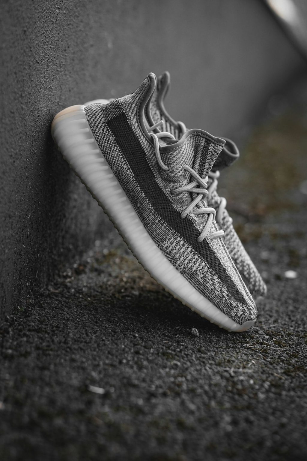 black and white nike low top sneakers yeezy sneakers display, minimalist fashion website, neutral tone sneakers