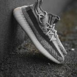 black and white nike low top sneakers yeezy sneakers display, minimalist fashion website, neutral tone sneakers