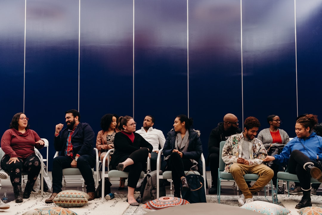 group of people sitting on chair leader, listening, diverse group, dialogue