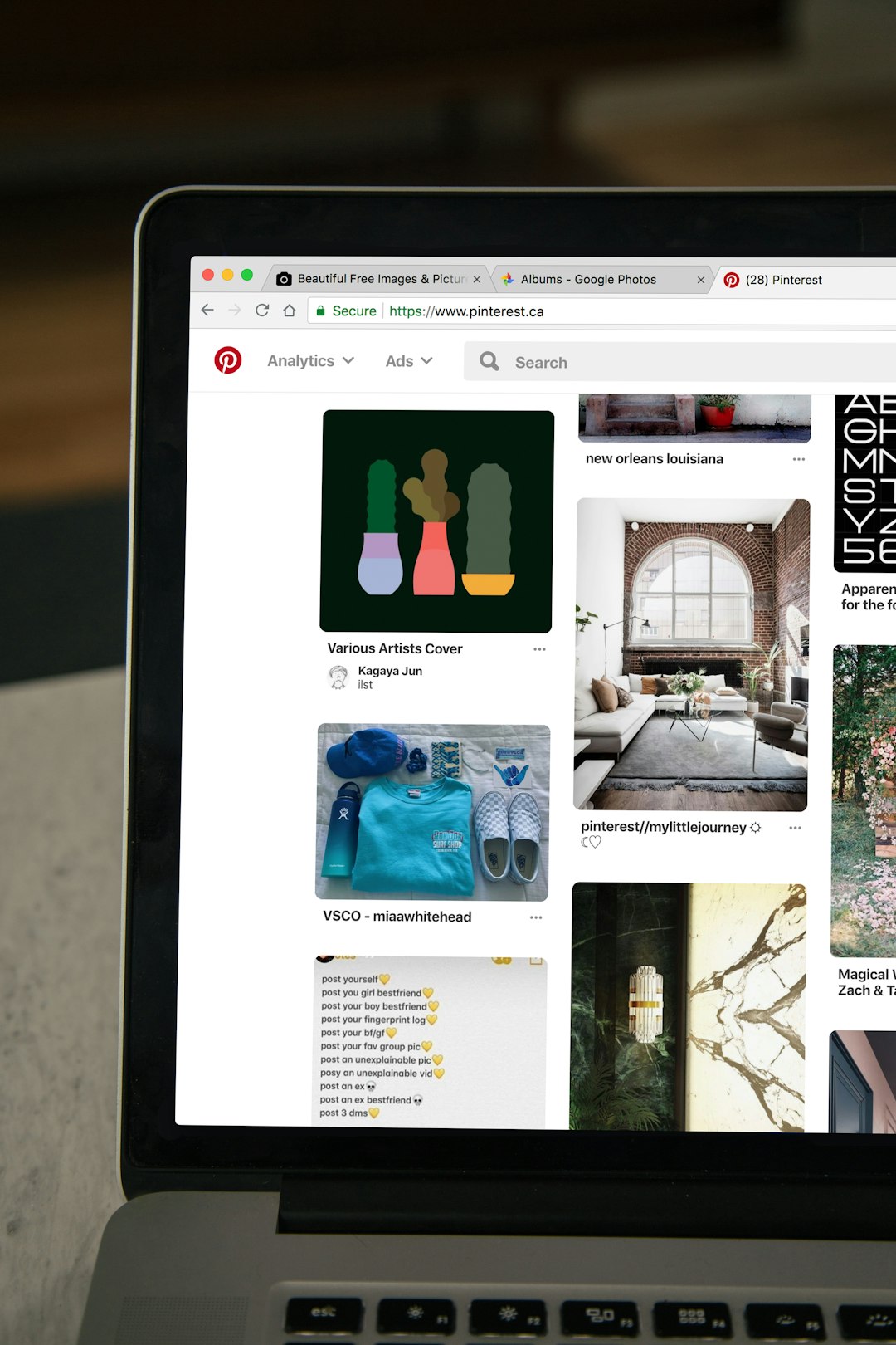MacBook displaying Pinterest website ecommerce catalog, product cutouts, clean layout