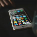 selective focus photography of turned-on gold iPhone 6s music apps comparison, streaming services, desktop icons
