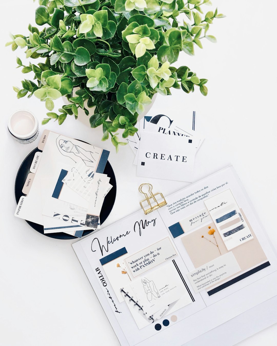 white printer paper on white table creative workspace notes client planning