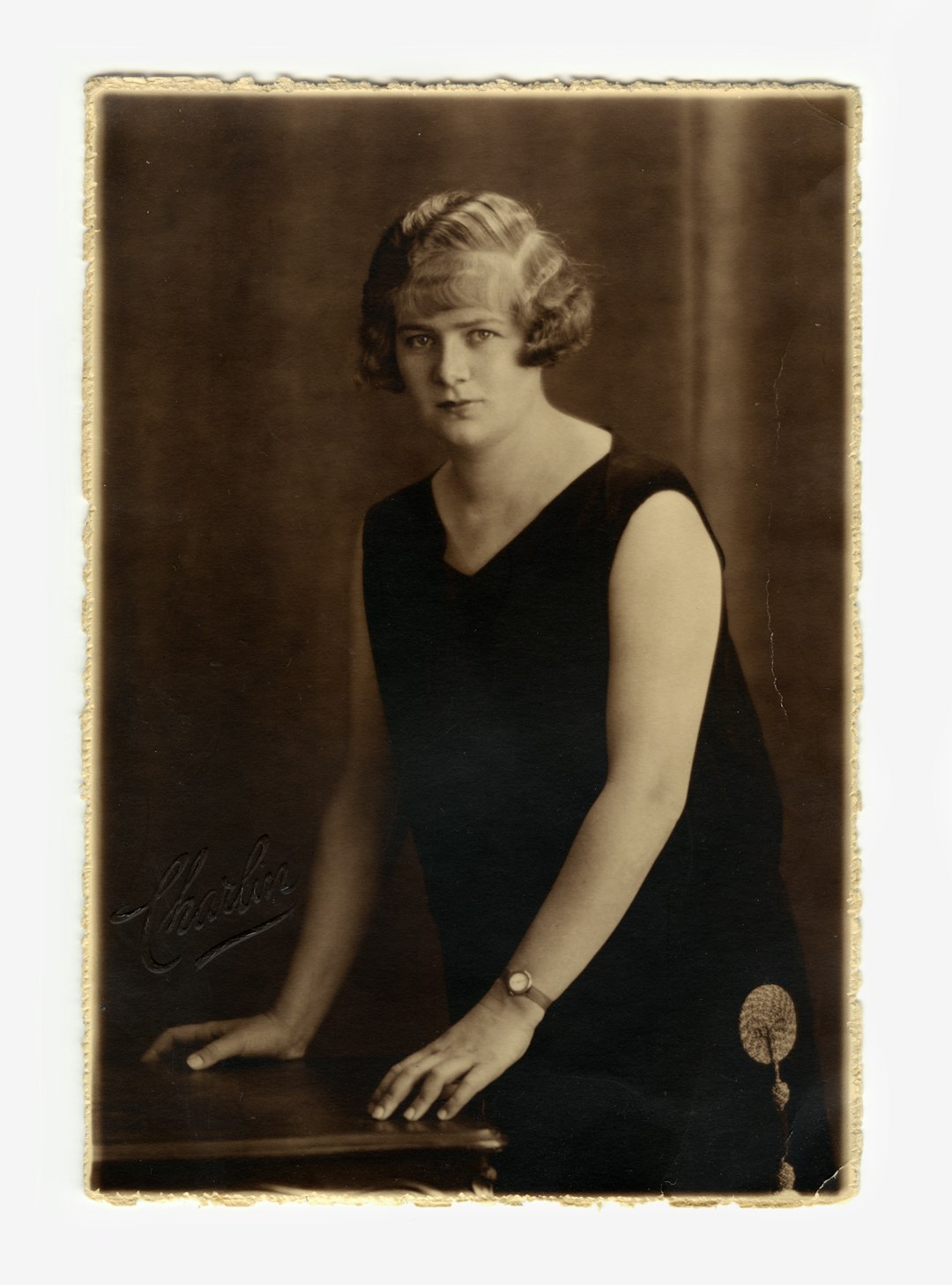 woman in black tank top and black pants old photo restoration, enhanced portrait detail, restored vintage photograph