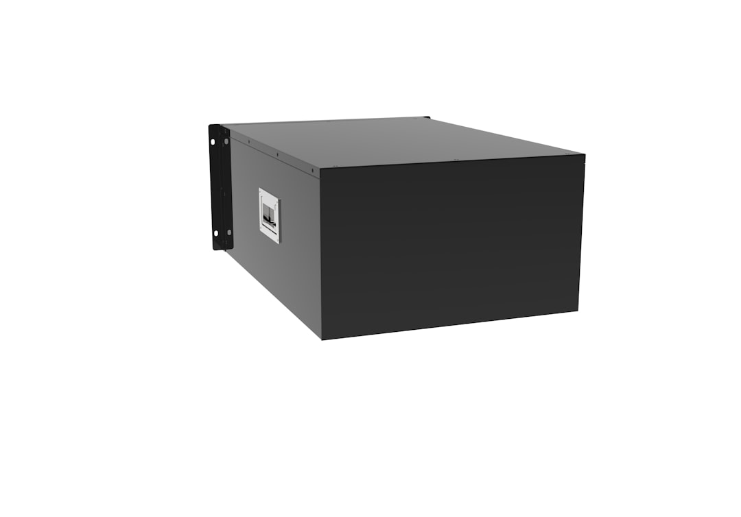 a black box sitting on top of a white wall liquid cooling, server rack, advanced engineering