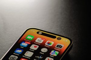 a black cell phone iphone 16 plus, large display, performance testing