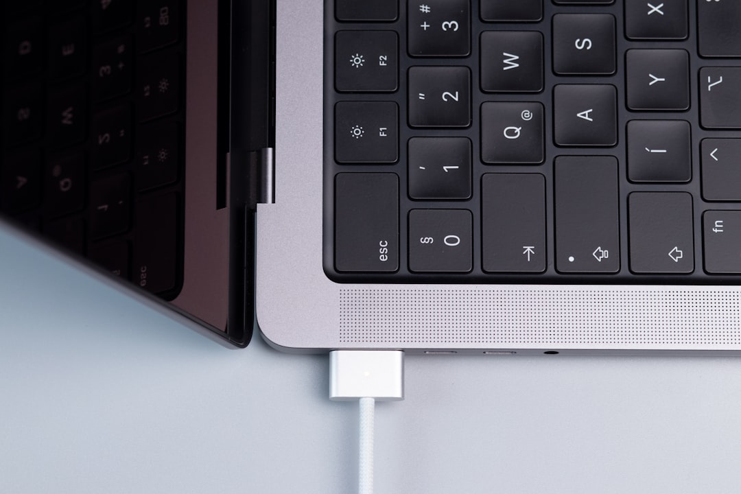a black keyboard with a white background macbook thunderbolt cable screen sharing