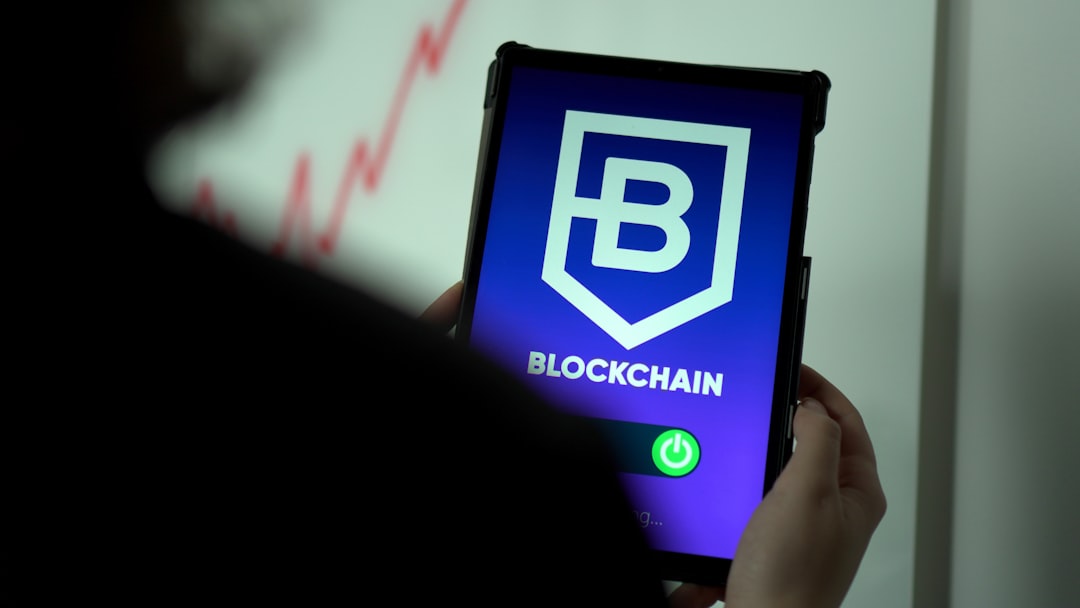 a person holding a cell phone with a blockchain logo on it financial compliance, risk management, blockchain regulation