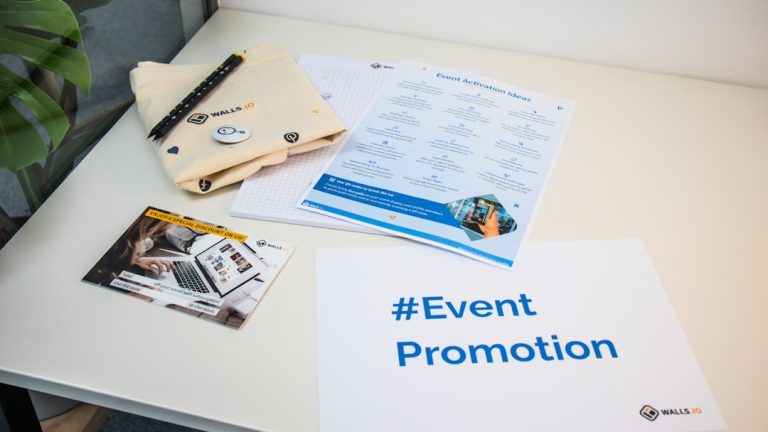 a table with a brochure, magazine, and pen on it event flyers, invitation design, promotional materials