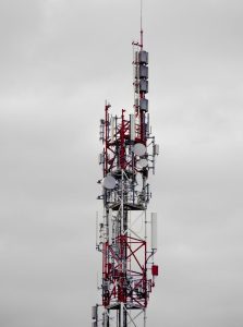 a very tall tower with lots of antennas on top of it emergency dispatch, cloud network, public safety