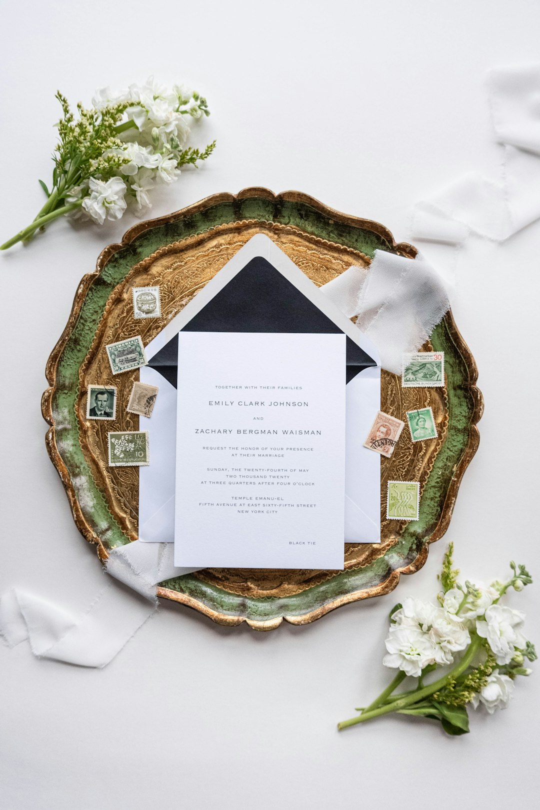 a wedding stationery with a black and white envelope printed invitations, event stationery, professional flyer stack