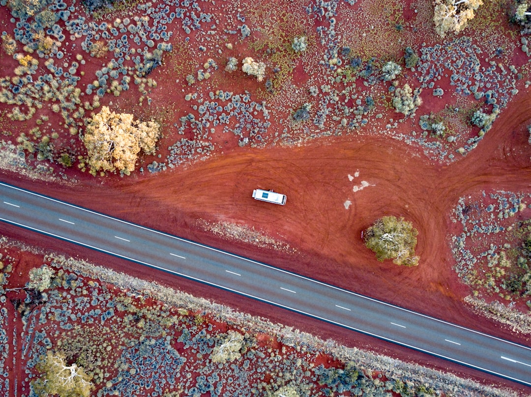 aerial view photography of white vehicle beside road road design, terrain model, survey data