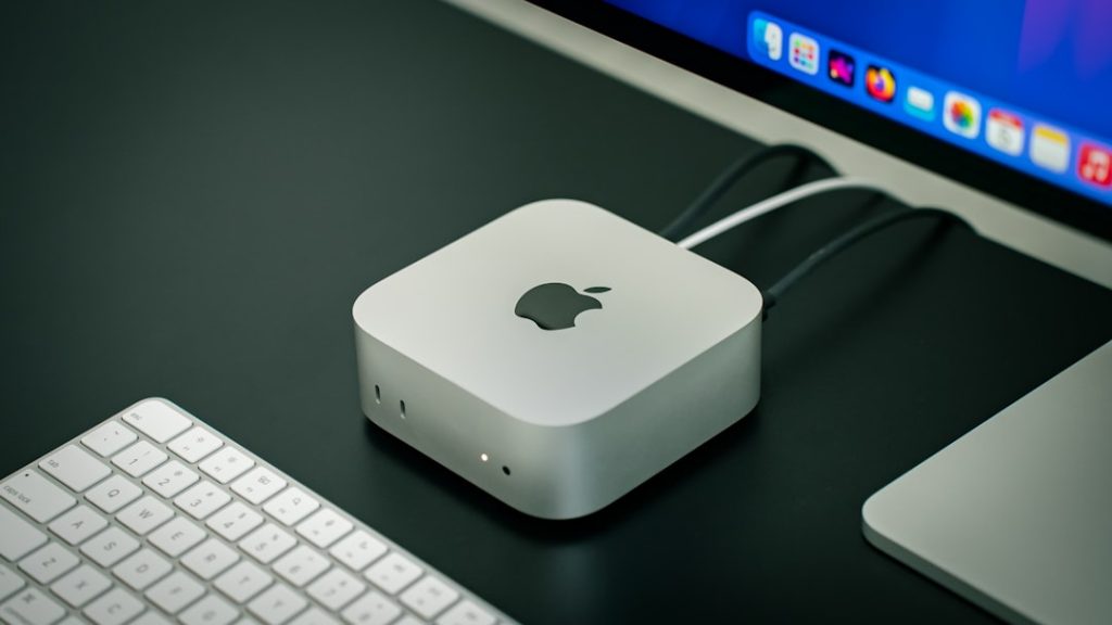 An apple computer with a keyboard and mouse mac remote access security network