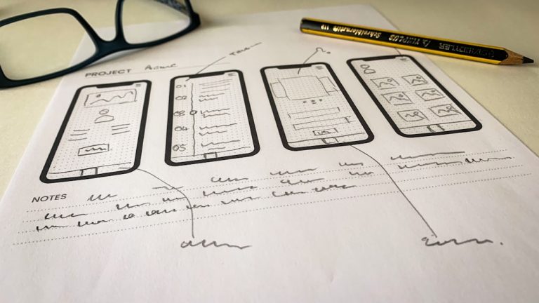 black framed eyeglasses on white printer paper user testing, app prototype, designers, mobile ux research