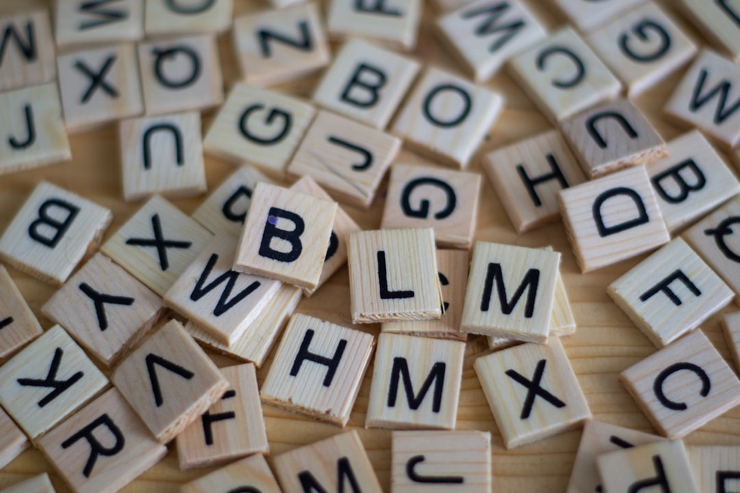brown wooden blocks with numbers mobile word game, letter tiles, puzzle board