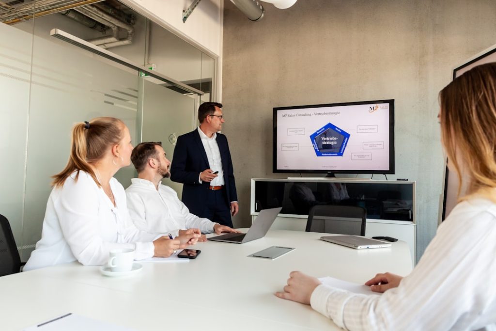Business meeting with a presenter and colleagues in office. cybersecurity training, team meeting, data protection, secure habits