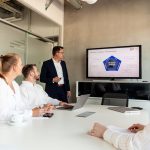 Business meeting with a presenter and colleagues in office. cybersecurity training, team meeting, data protection, secure habits