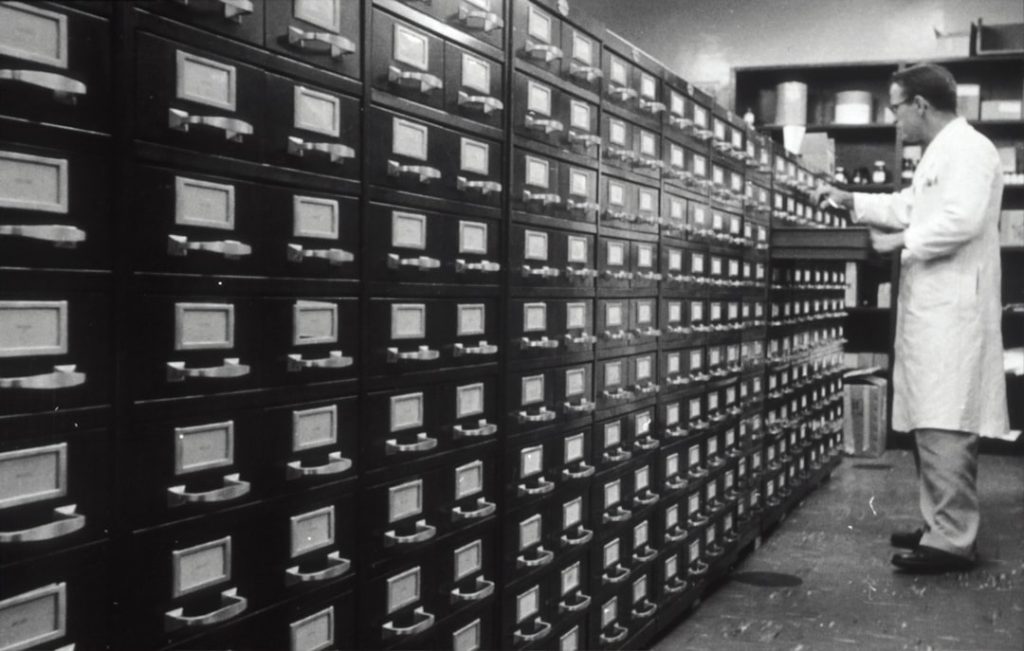 grayscale photo of man digital files, secure access, resource library
