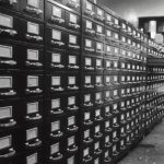 grayscale photo of man digital files, secure access, resource library