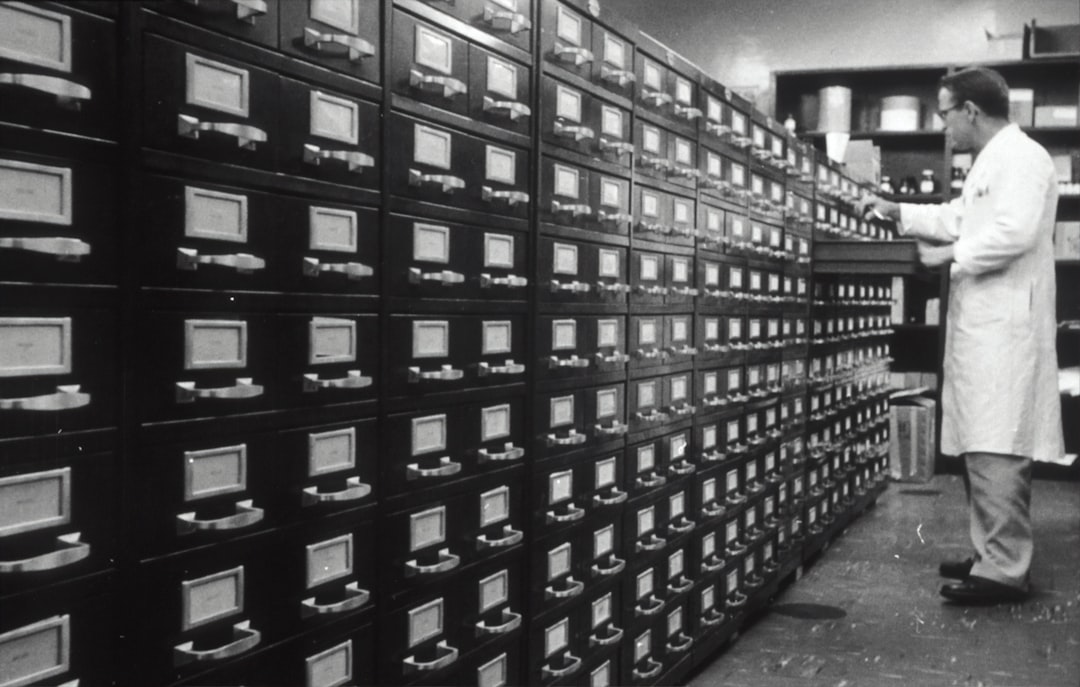 grayscale photo of man digital files, secure access, resource library