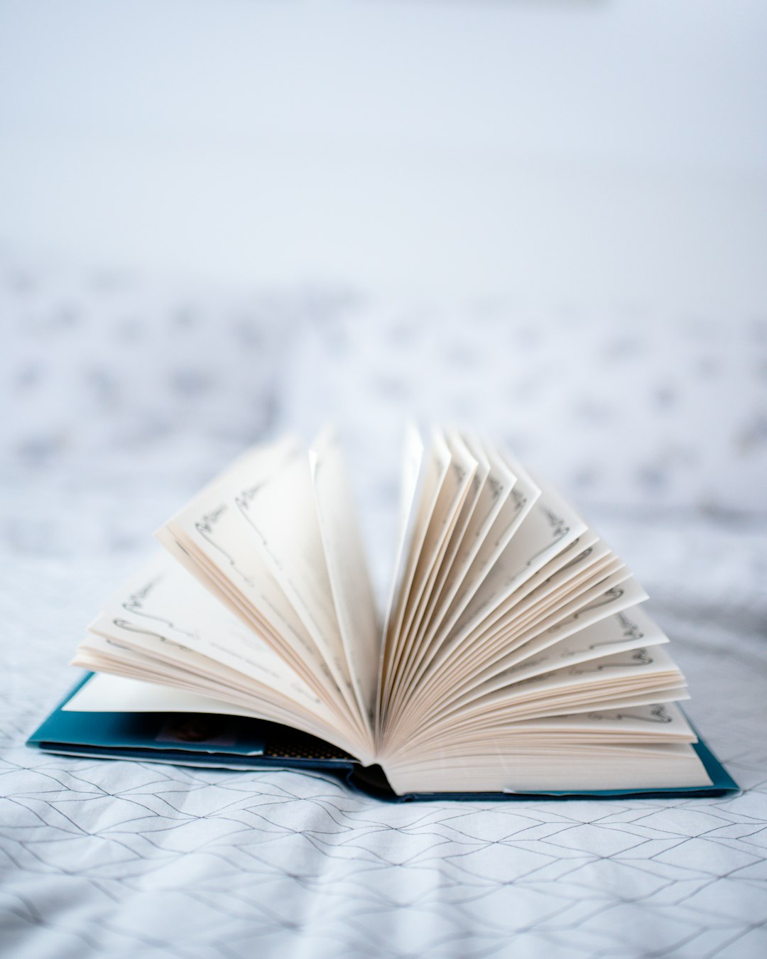 opened book on white textile happy reader, open book, learning progress