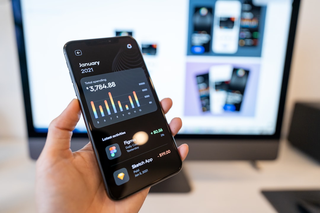 person holding black android smartphone enterprise app design, business team, mobile dashboard, design system