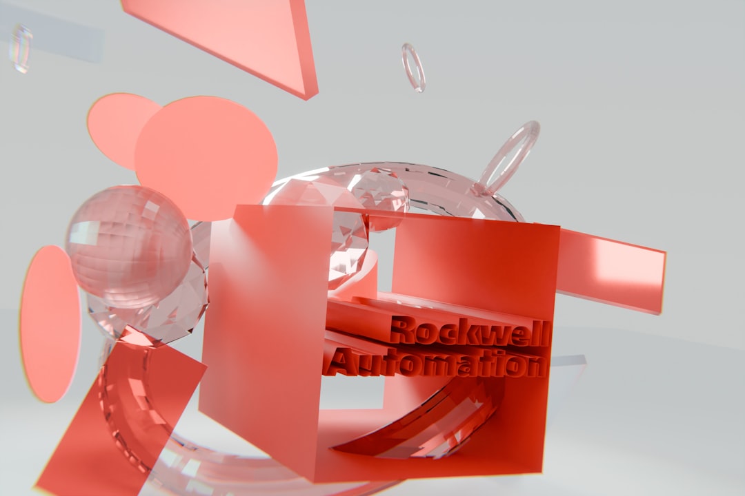 Red geometric shapes and glass spheres with "rockwell automation" text. workflow automation, connected apps, digital process