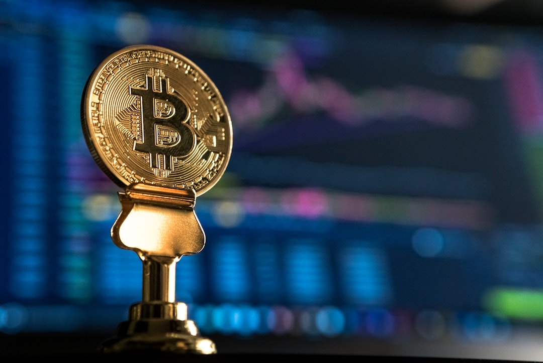selective focus photo of Bitcoin near monitor tokenized assets, blockchain dashboard, digital finance