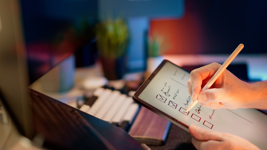 Someone is writing on a tablet with a stylus. regulated industry, audit checklist, digital signatures