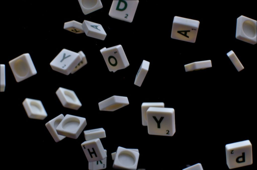white and black letter t-letter blocks mobile word game, letter tiles, puzzle board