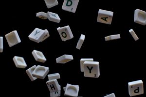 white and black letter t-letter blocks mobile word game, letter tiles, puzzle board