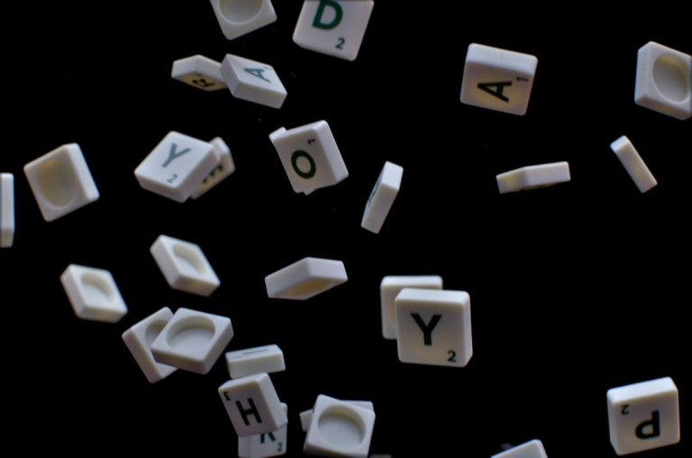white and black letter t-letter blocks mobile word game, letter tiles, puzzle board