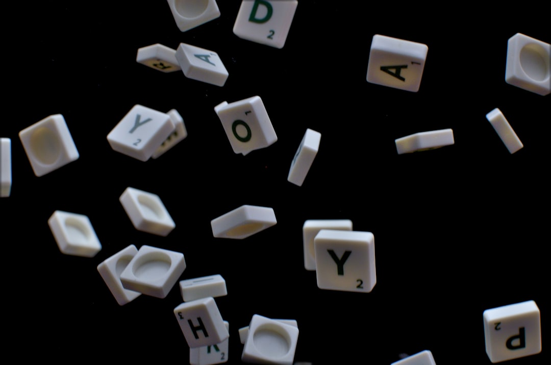 white and black letter t-letter blocks mobile word game, letter tiles, puzzle board