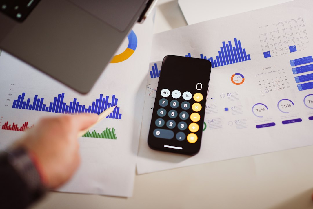 a calculator sitting on top of a table next to a laptop pricing chart, resource planning, cloud costs, calculator