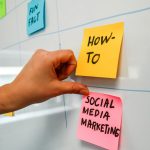 a hand is pointing to sticky notes on a bulletin board email tags, customer segments, marketing workflow