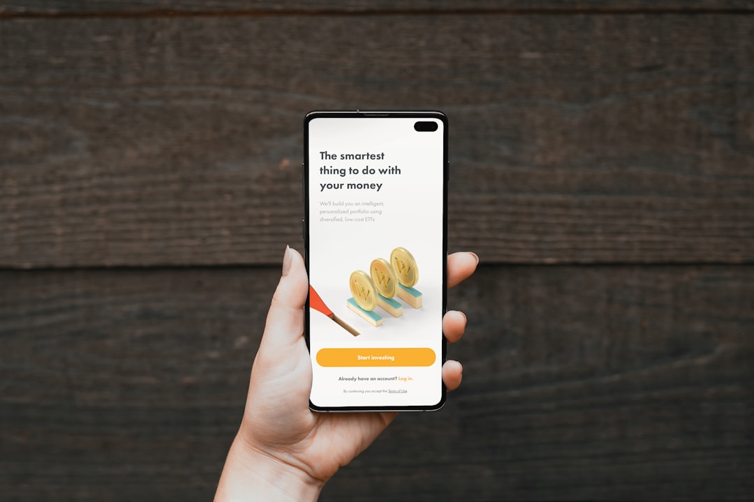 a person holding a cell phone with a website on the screen mobile form, simple fields, easy signup