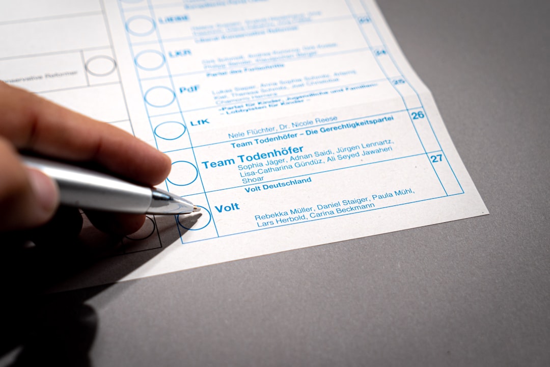a person holding a pen over a piece of paper qualification checklist, budget review, decision process
