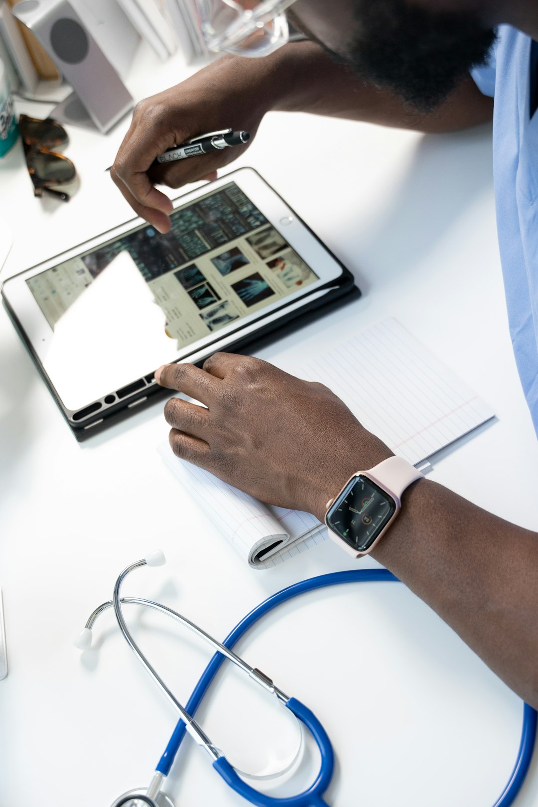 a person using a tablet healthcare compliance, finance documents, secure communication