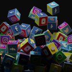 a pile of colorful cubes with social icons flying out of them social media ads, product videos, competitor analysis