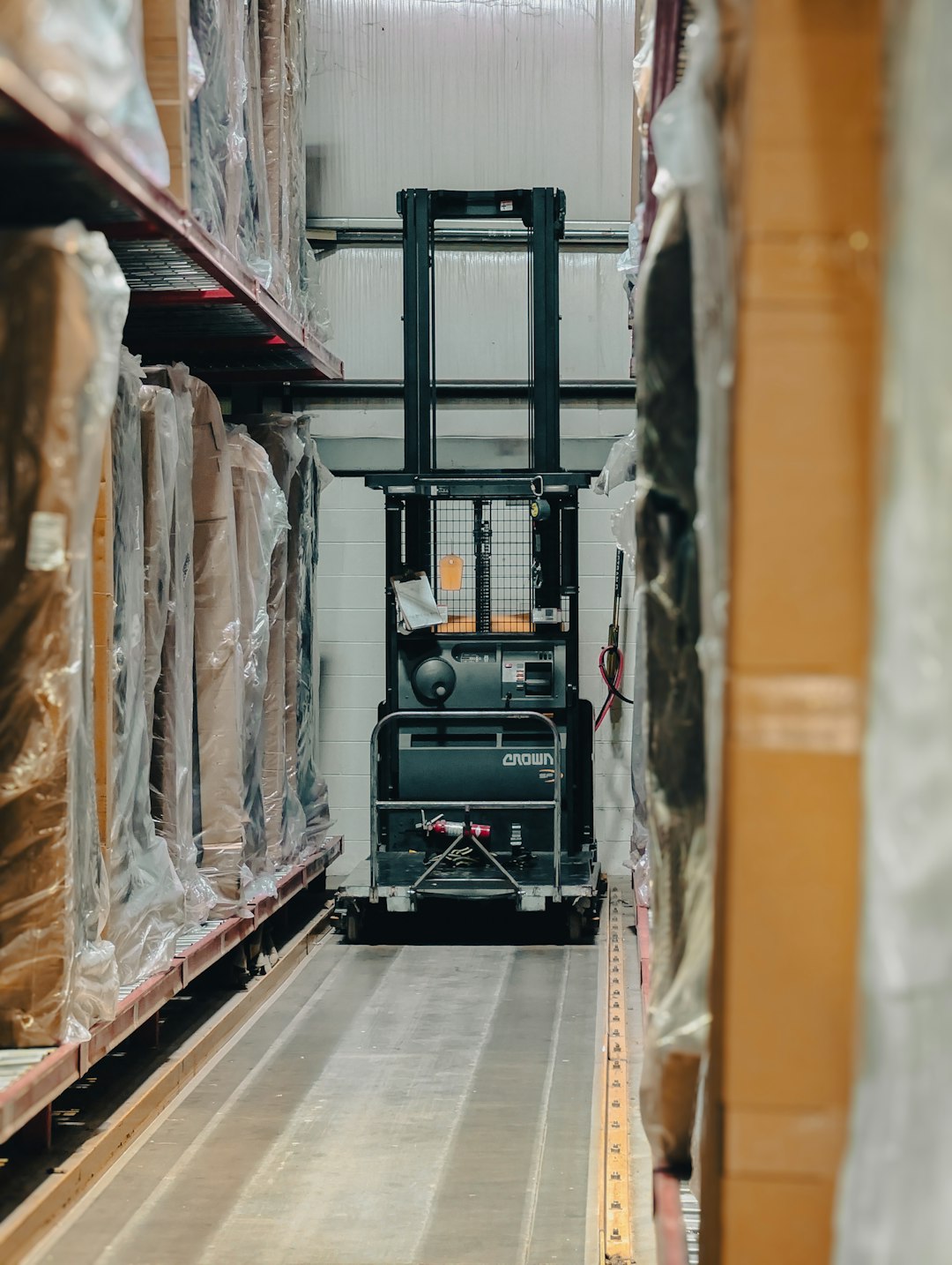 A warehouse filled with lots of boxes and pallets warehouse shelves, packing boxes, shipping labels