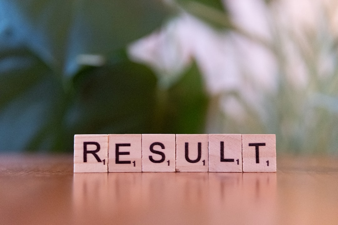 A wooden block spelling the word result on a table case study, business results, client success